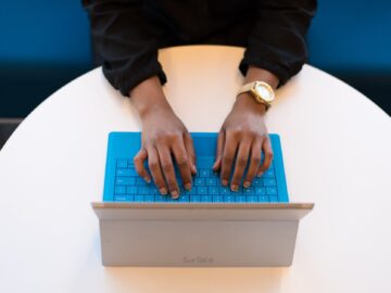 person typing on a laptop