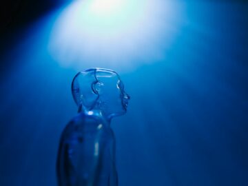 clear mannequin on dark blue background