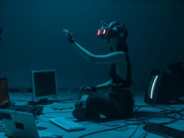 a woman in a tank top using a vr headset