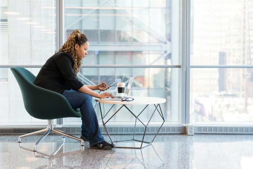 woman sitting on blue and gray chair