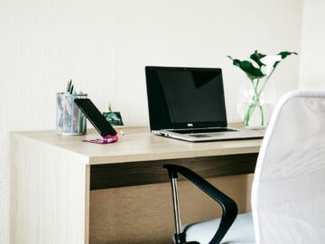 laptop computer on brown wooden desk