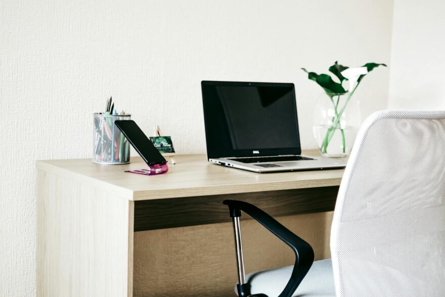 laptop computer on brown wooden desk