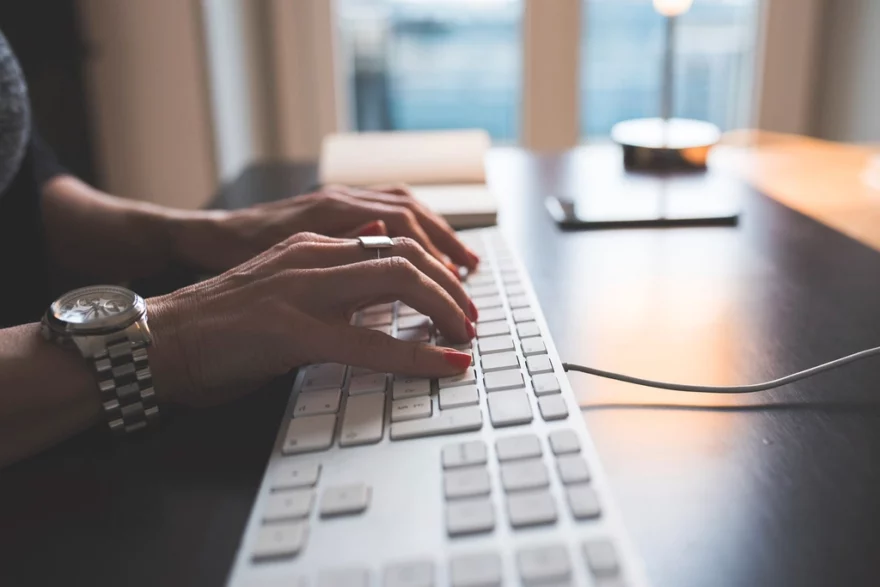 Woman Typing Computer Keyboard