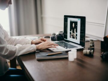 selective focus photography of woman using macbook pro