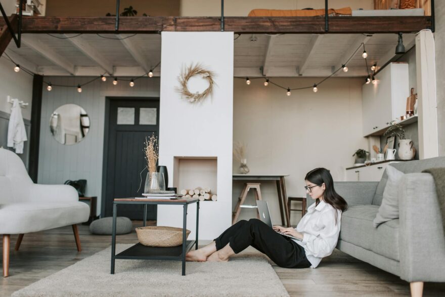 woman sitting on the floor using laptop